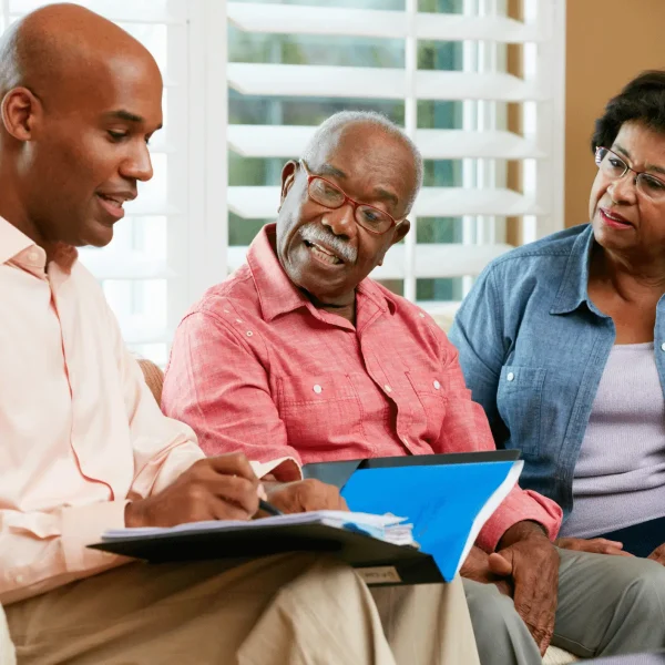 Smiling woman giving a thumbs-up gesture.